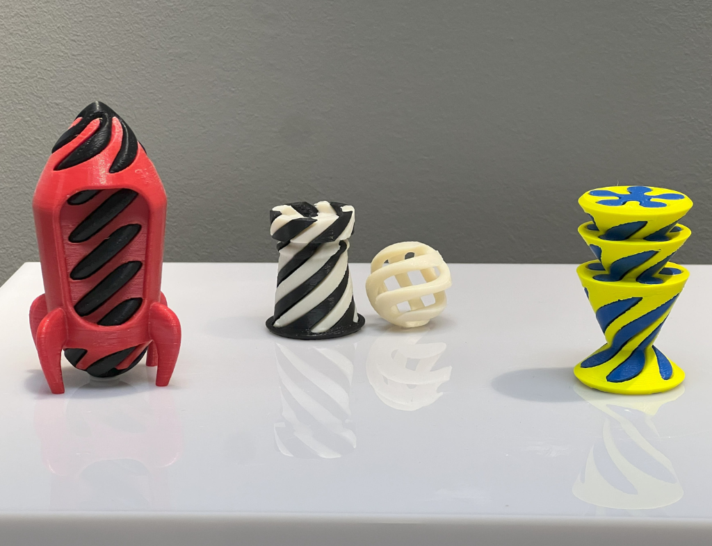 Red and black, white and black, and yellow and blue Vortex Collection models